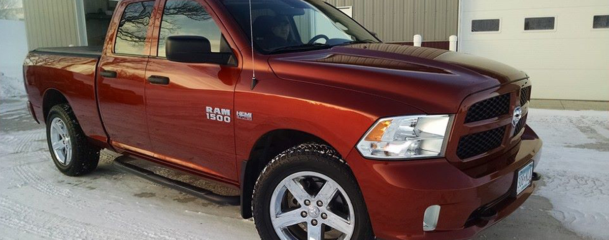 Shiny red Dodge Ram truck just detailed by NCS Auto & Detail