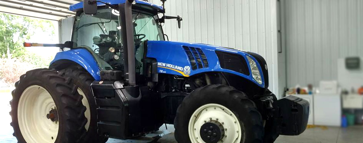 Large New Holland tractor freshly detailed at NCS Auto & Detail in Sauk Centre, MN